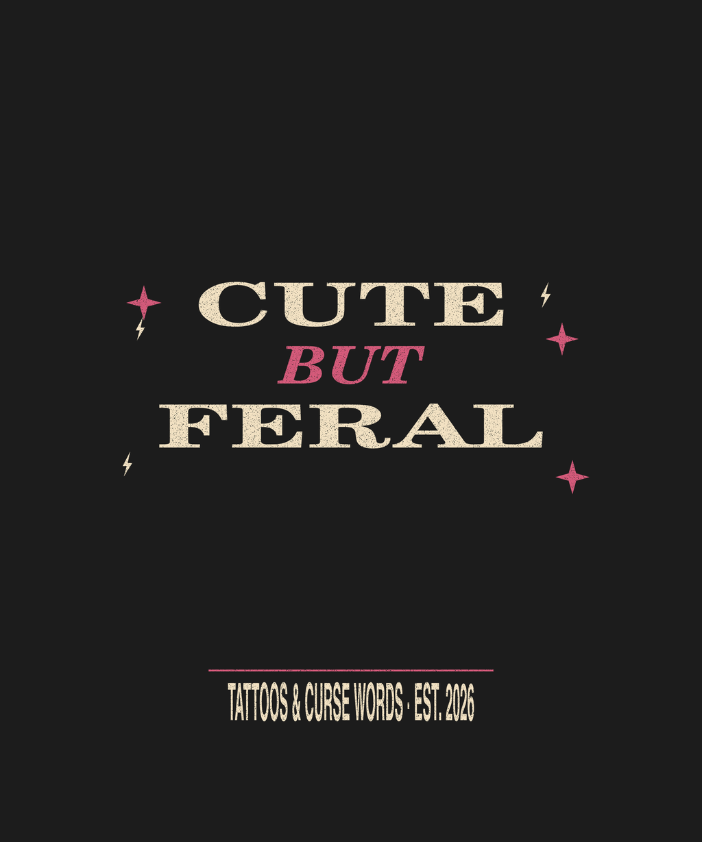 Cute But Feral skull — black tee lettering